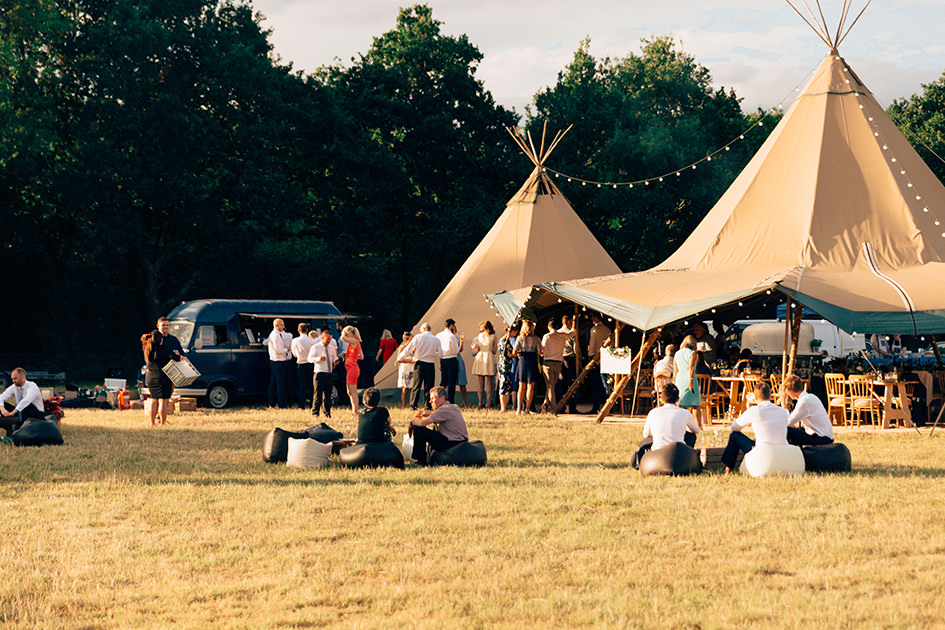 tipis in a field for hire hot sunny day