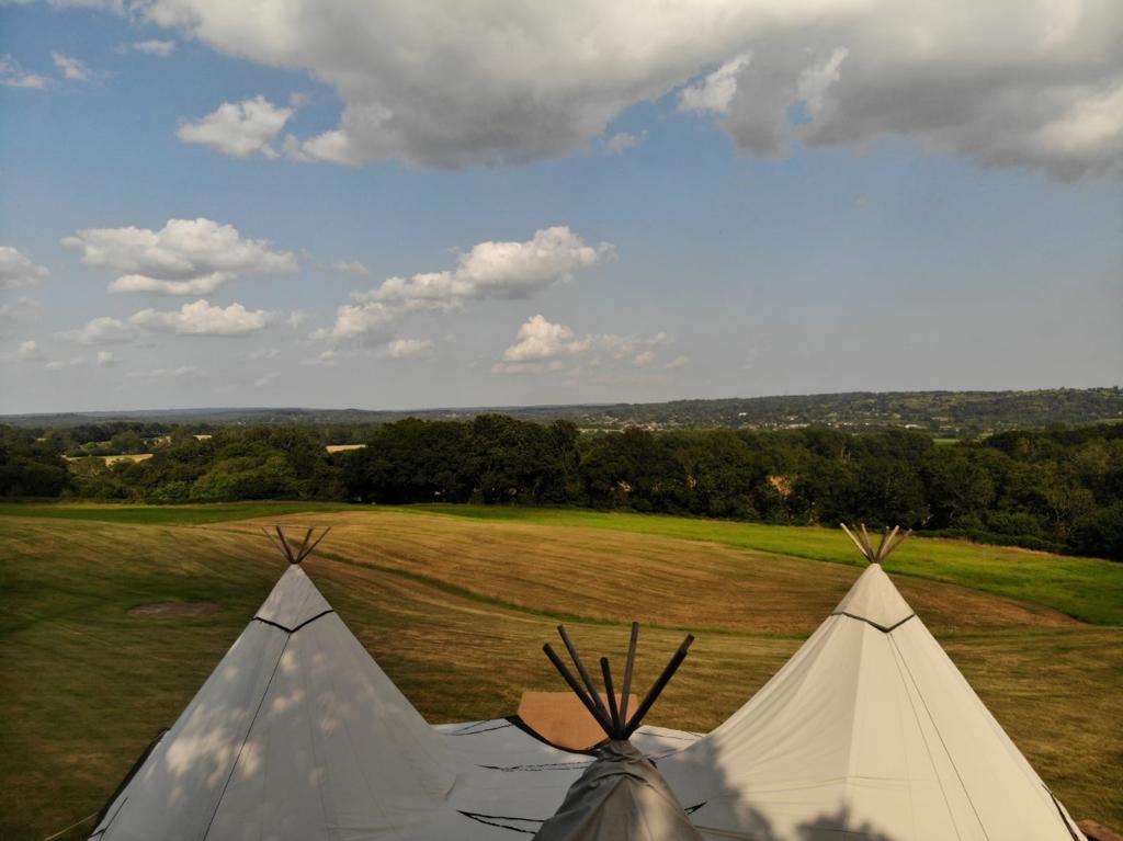 drone shot above tipis looking at the view