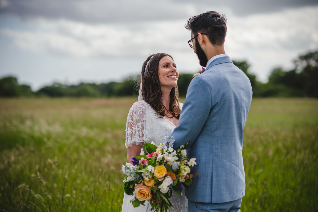 newly wed couple in a field