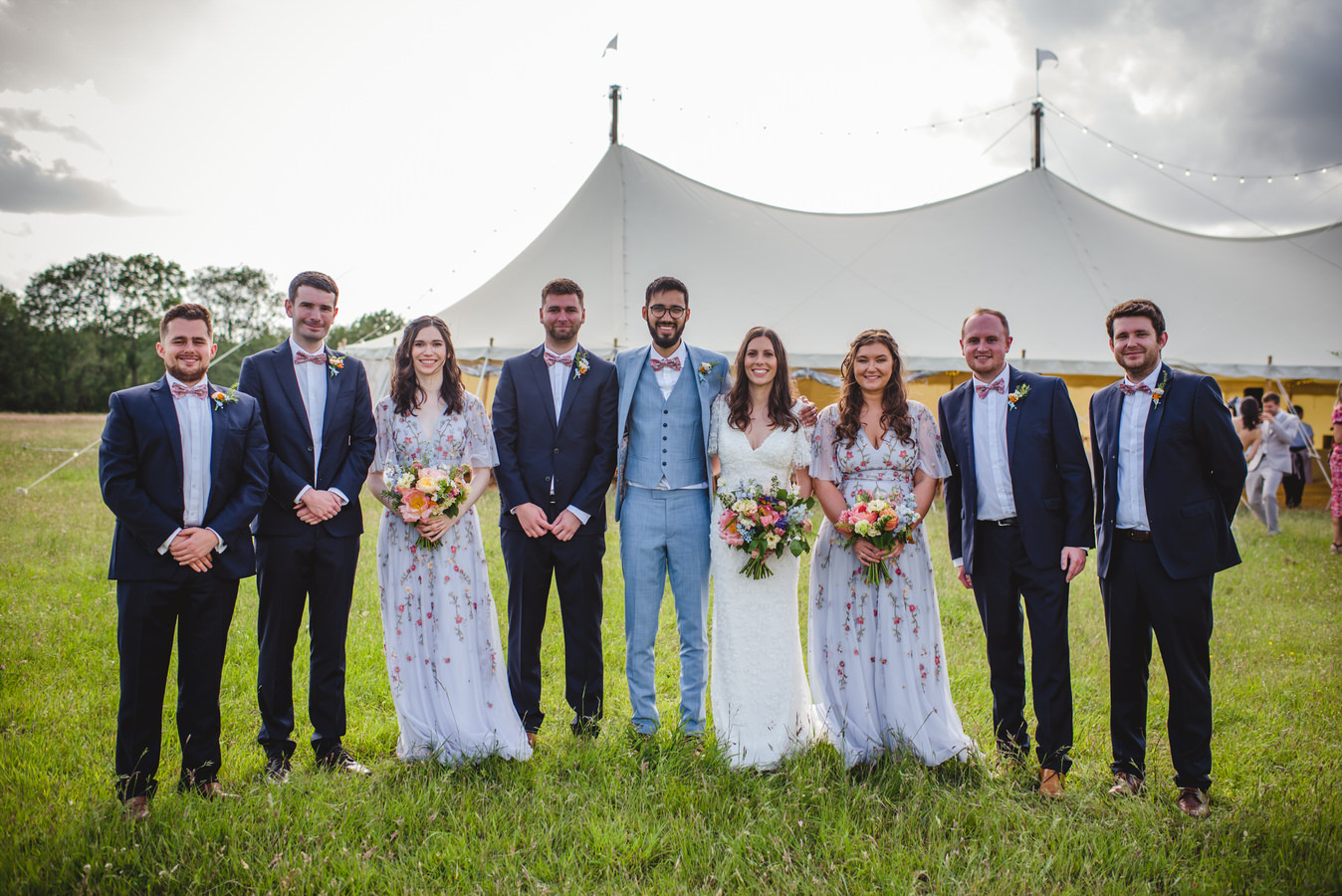 bridal party outside a marquee