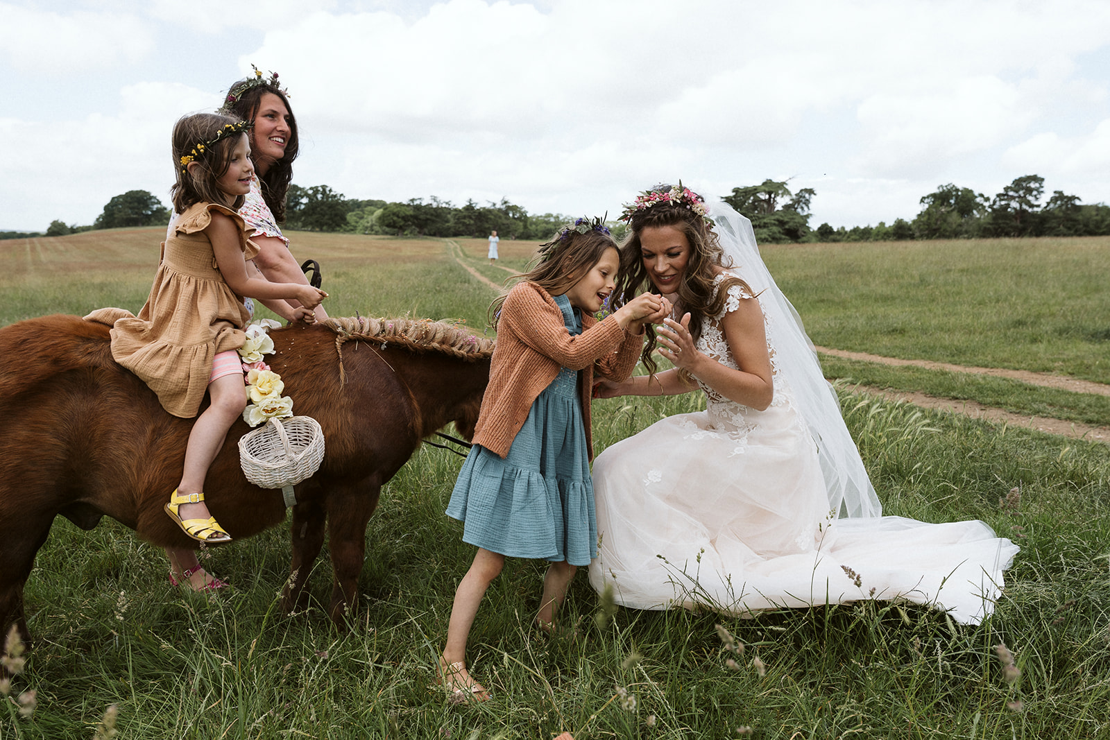 bride, bridesmaids and a miniature pony