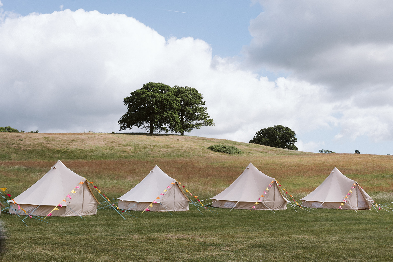 bell tents in a field